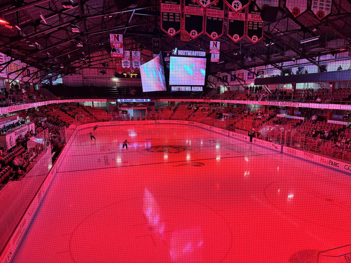 historic matthews arena in a hockey configuration lit up red before a game
