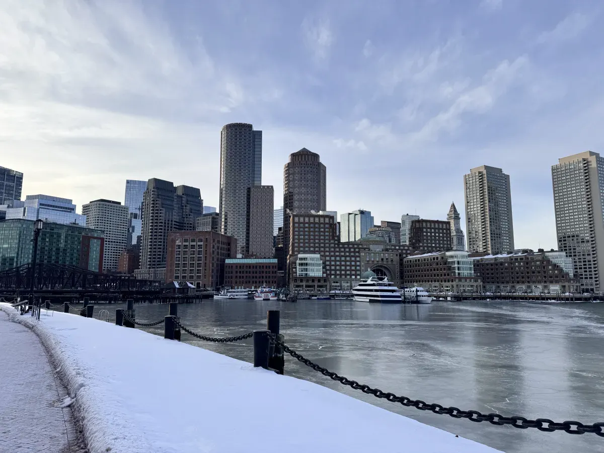 The Boston Skyline seen from the Seaport Neighborhood during a snowy winter day